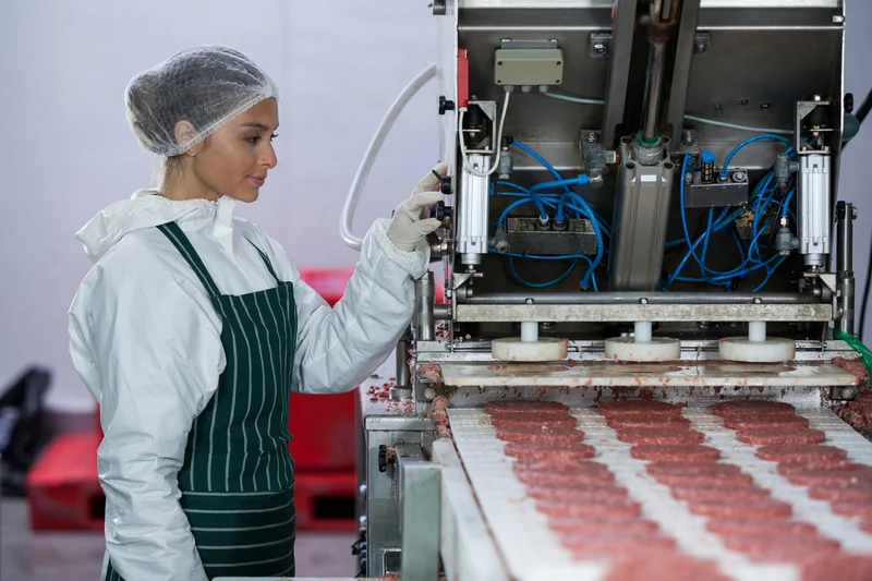 woman-operating-food-processing-machine-in-factory-eurocruitment